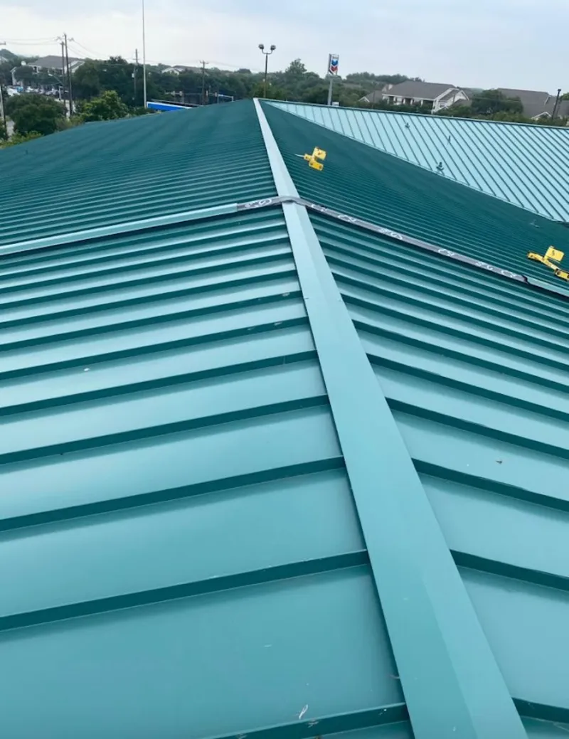 Green commercial metal roof ridge and valley for Metal Roof Repair in Giddings