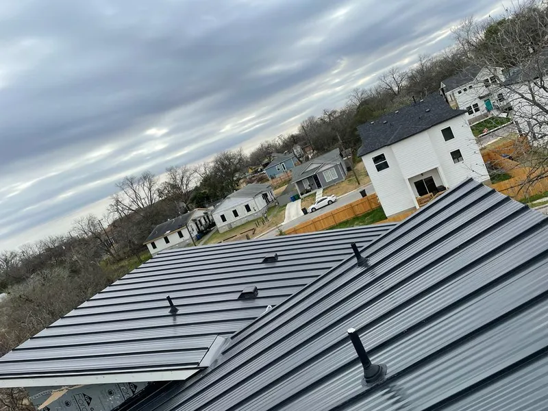 Standing seam metal roof panels with vents for Skylight Repair in Giddings